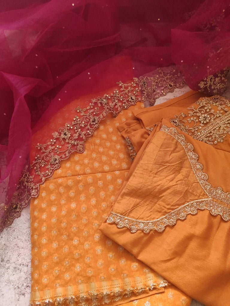 Mustard yellow with pink dupatta dress material. - Neel Creations By Saanvi